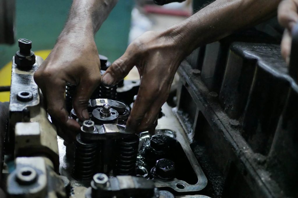 remaps burnley 10 hands repairing a car engine